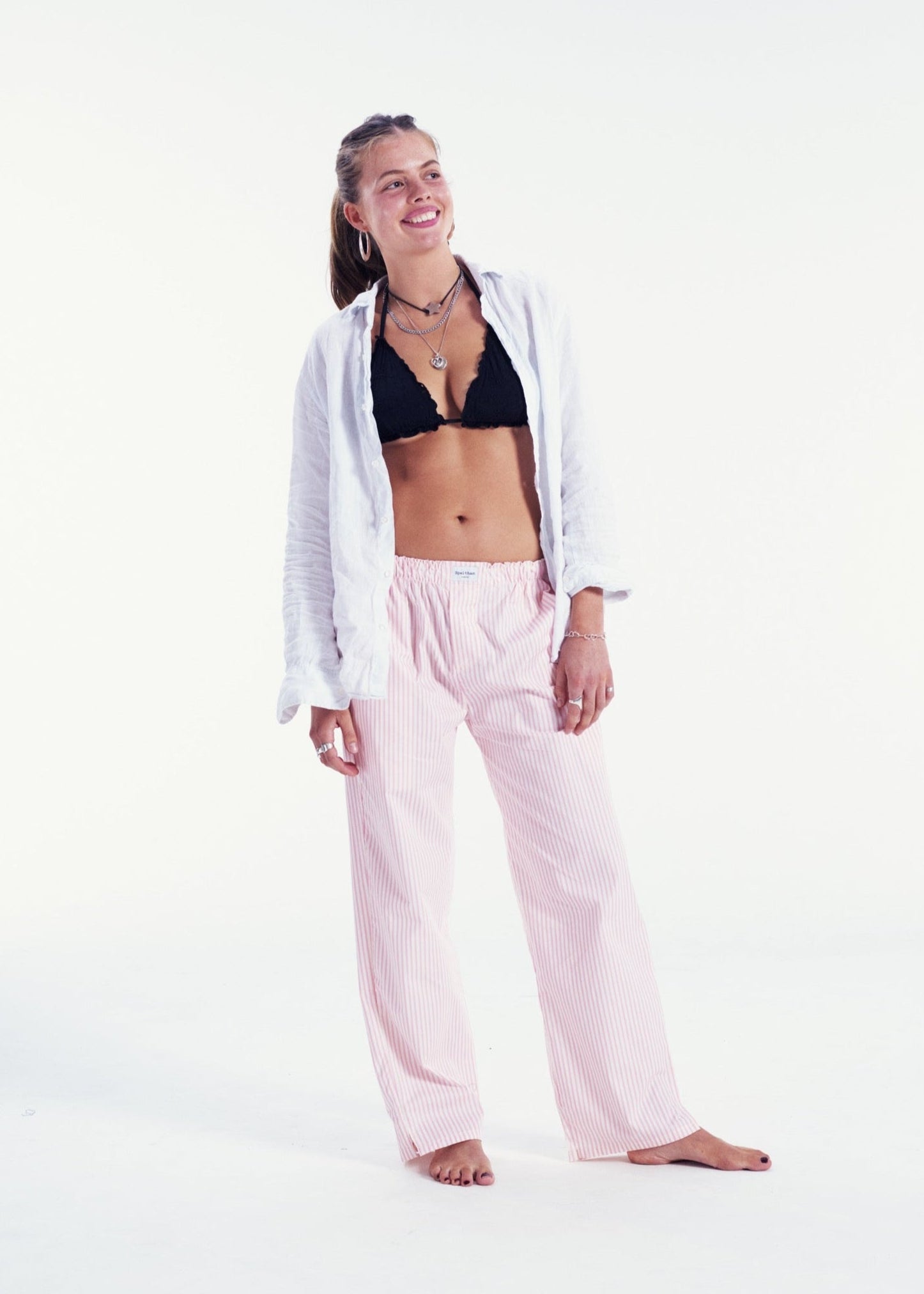 Pink and white striped pants online